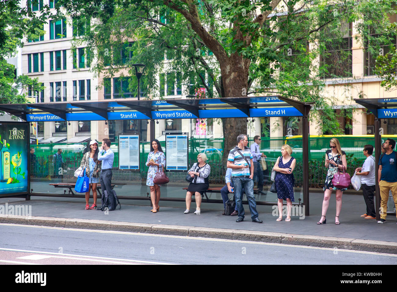 People in Sydney waiting for a bus stood at Wynyard bus stop in york street,Sydney city centre,Australia Stock Photo
