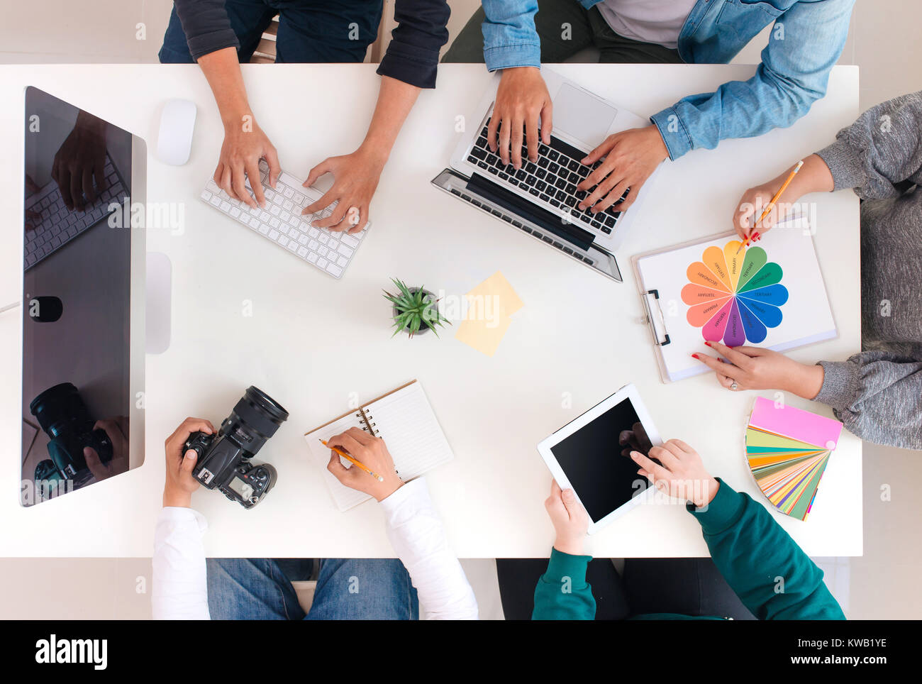 Young creative team having a meeting in creative office - teamwork concepts. Stock Photo
