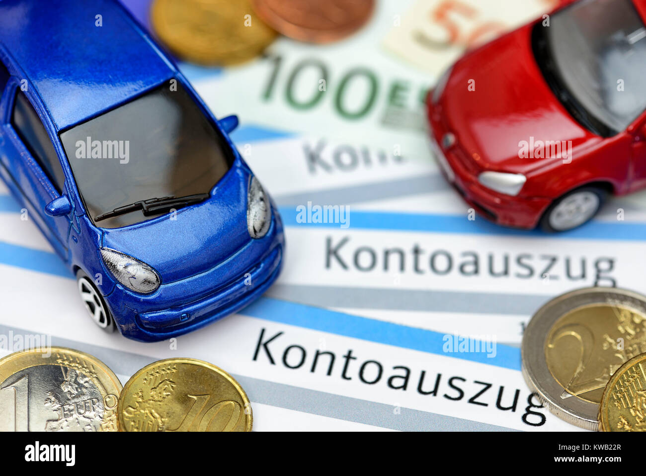 Miniature cars on bank statements, symbolic photo vehicle assurance, Miniaturautos auf Kontoausz?gen, Symbolfoto Kfz-Versicherung, Miniaturautos auf K Stock Photo