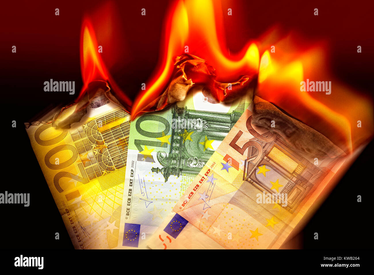 Burning euronotes, sinking eurocourse, Brennende Euroscheine, sinkender Eurokurs Stock Photo