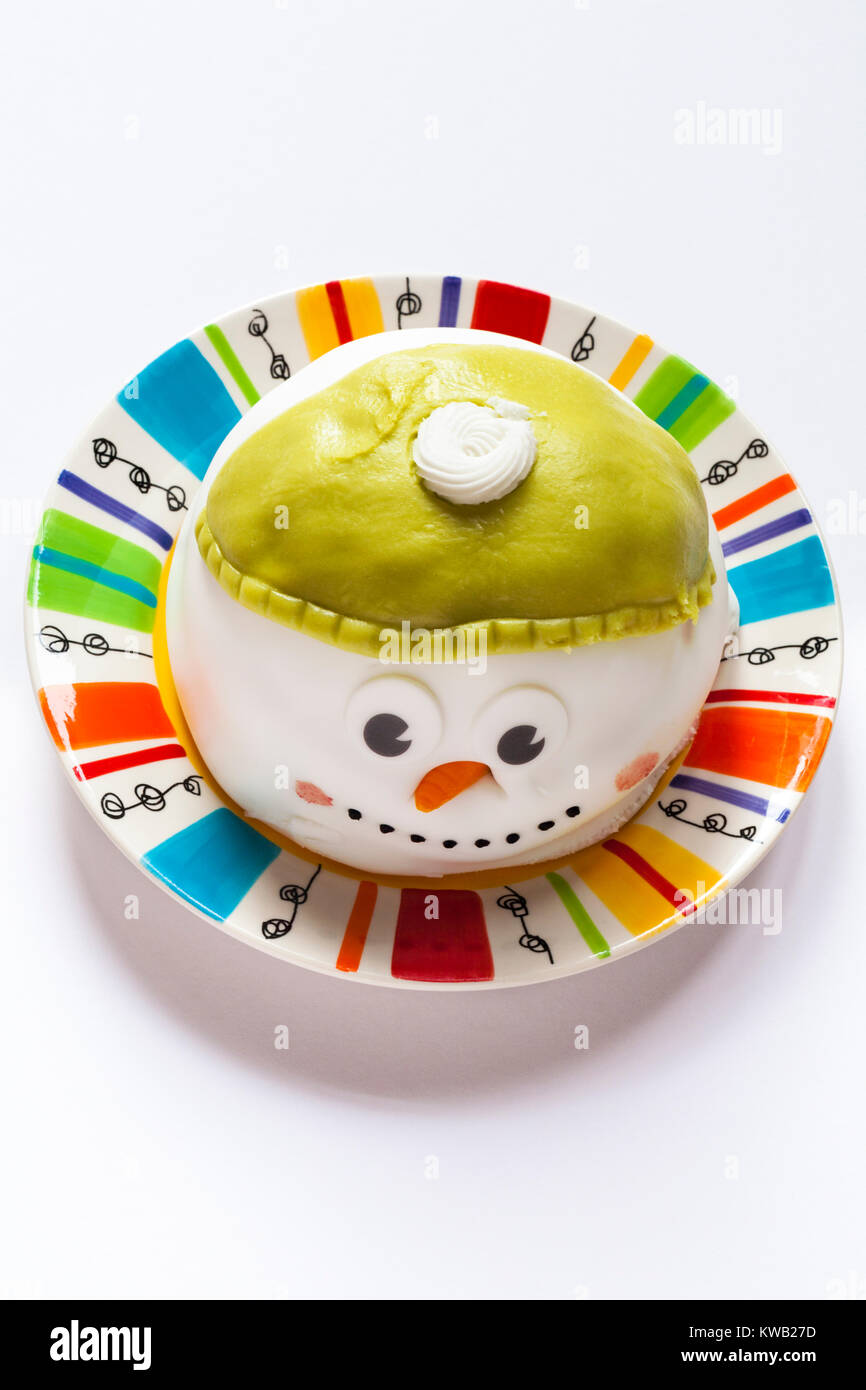 Iceland Christmas snowman cake on colourful plate isolated on white background Stock Photo