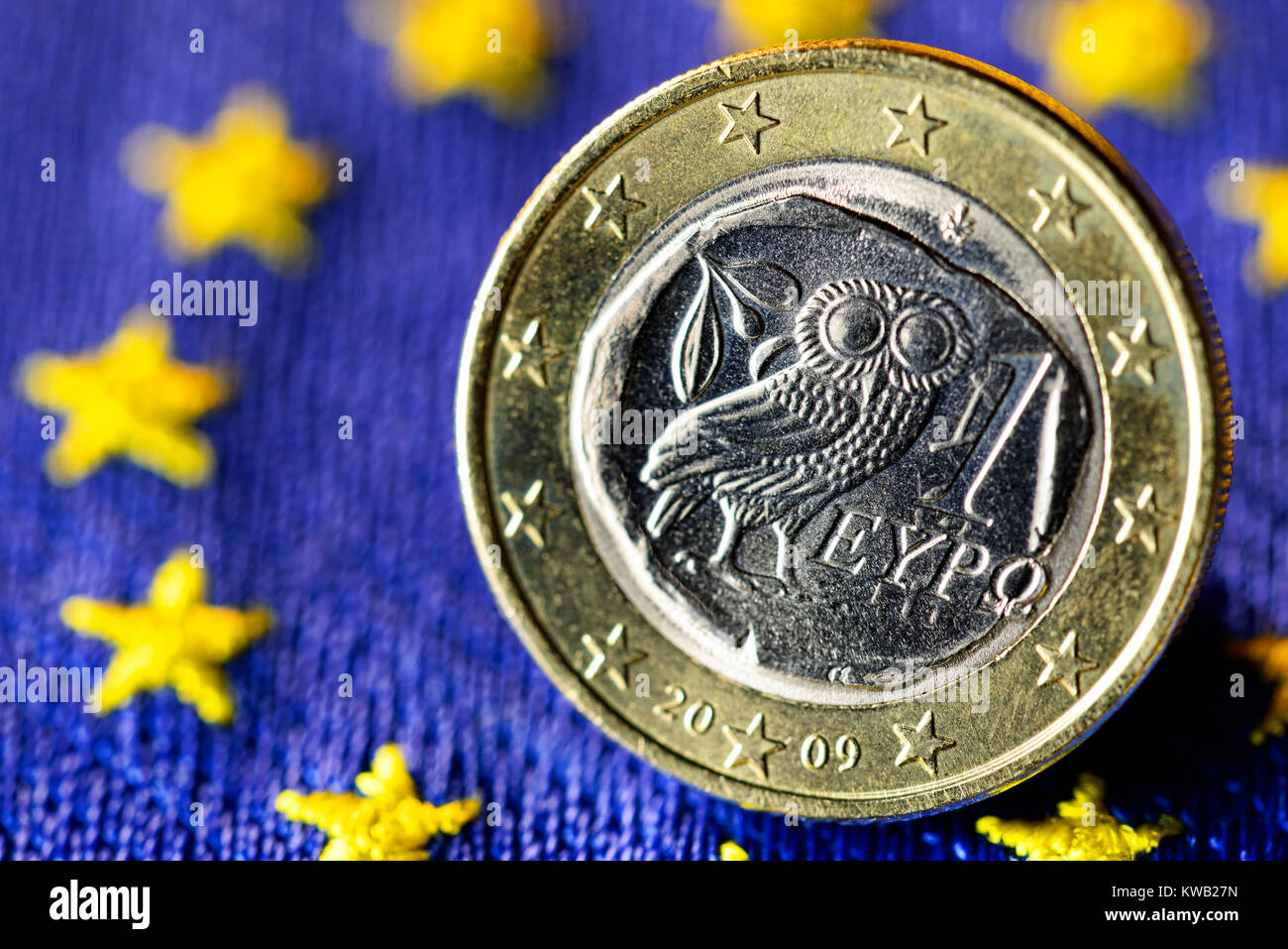 Greek euro-coin one on EU flag, Griechische Ein-Euro-M?nze auf EU-Fahne, Griechische Ein-Euro-Muenze auf EU-Fahne Stock Photo