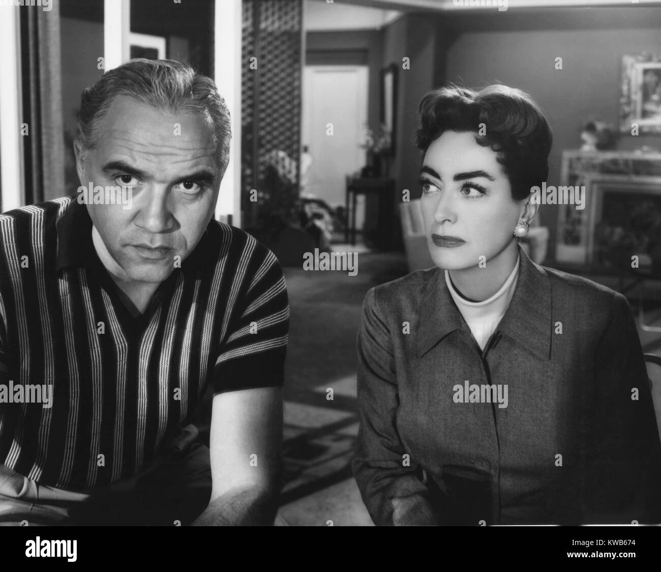 AUTUMN LEAVES, from left Lorne Greene, Joan Crawford, 1956 Stock Photo
