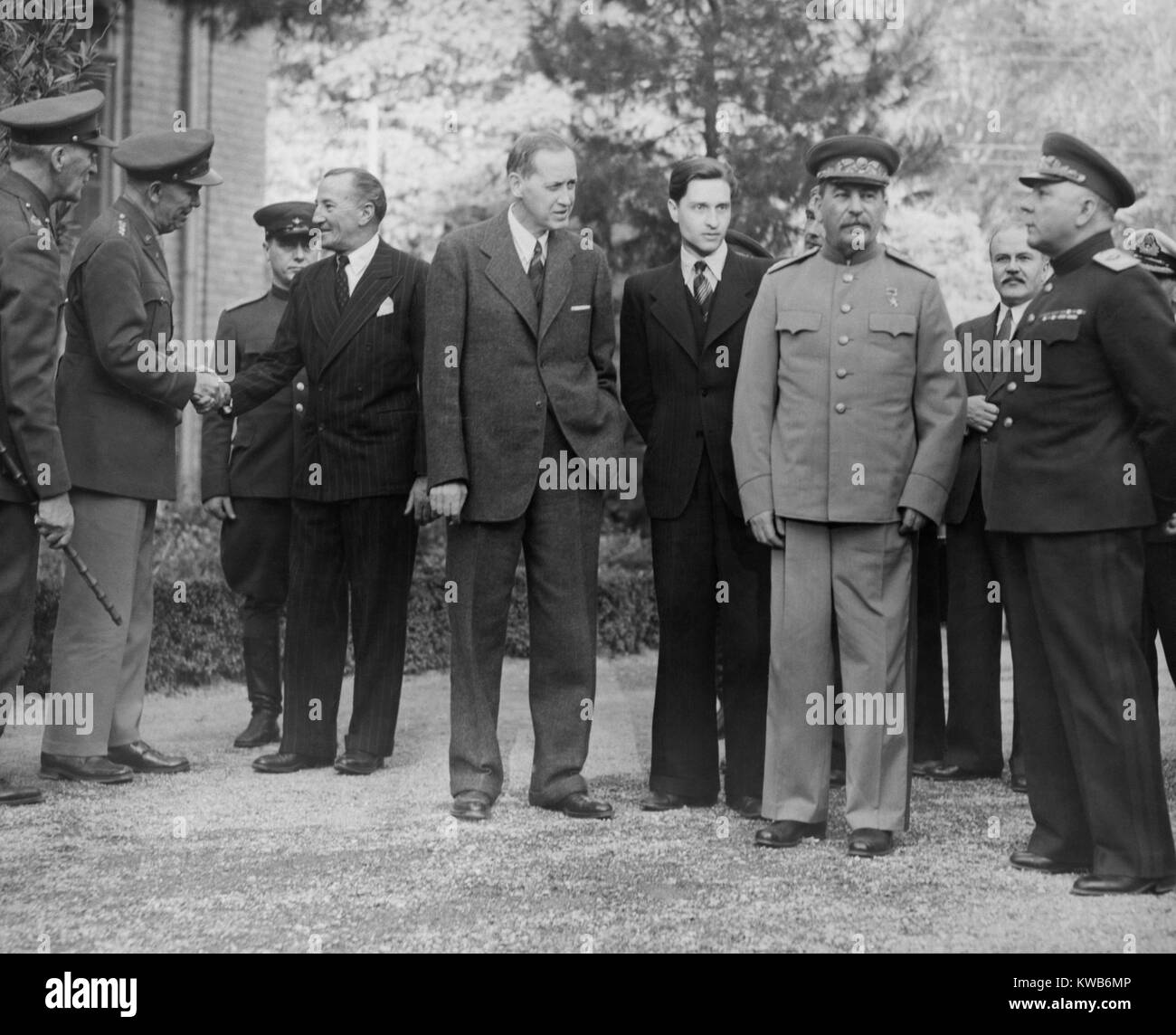 Allied leaders and delegates at the Teheran Conference. Dec. 1943. Outside the Russian Embassy, L-R: Gen. George Marshall shaking hands with Ambassador Archibald Clark Keer; Joseph Stalin, Foreign minister Vyacheslav Molotov, General Kliment Voroshilov. World War 2. (BSLOC 2014 8 200) Stock Photo