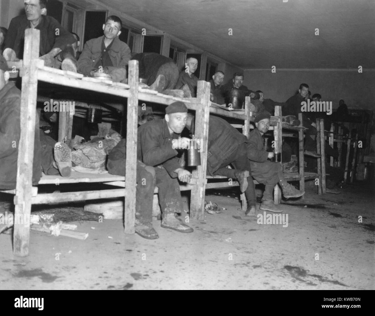 Allied prisoners in the 'Hospital' of a Nazi POW camp captured by the 9th U.S. Army. Over 22,000 prisoners from 11 nations were housed here, some for over five years. The 19,000 Russian prisoners were systematically fed half the rations of the other prisoners. Hemer, Germany, April 14, 1945. World War 2. (BSLOC 2014 8 94) Stock Photo