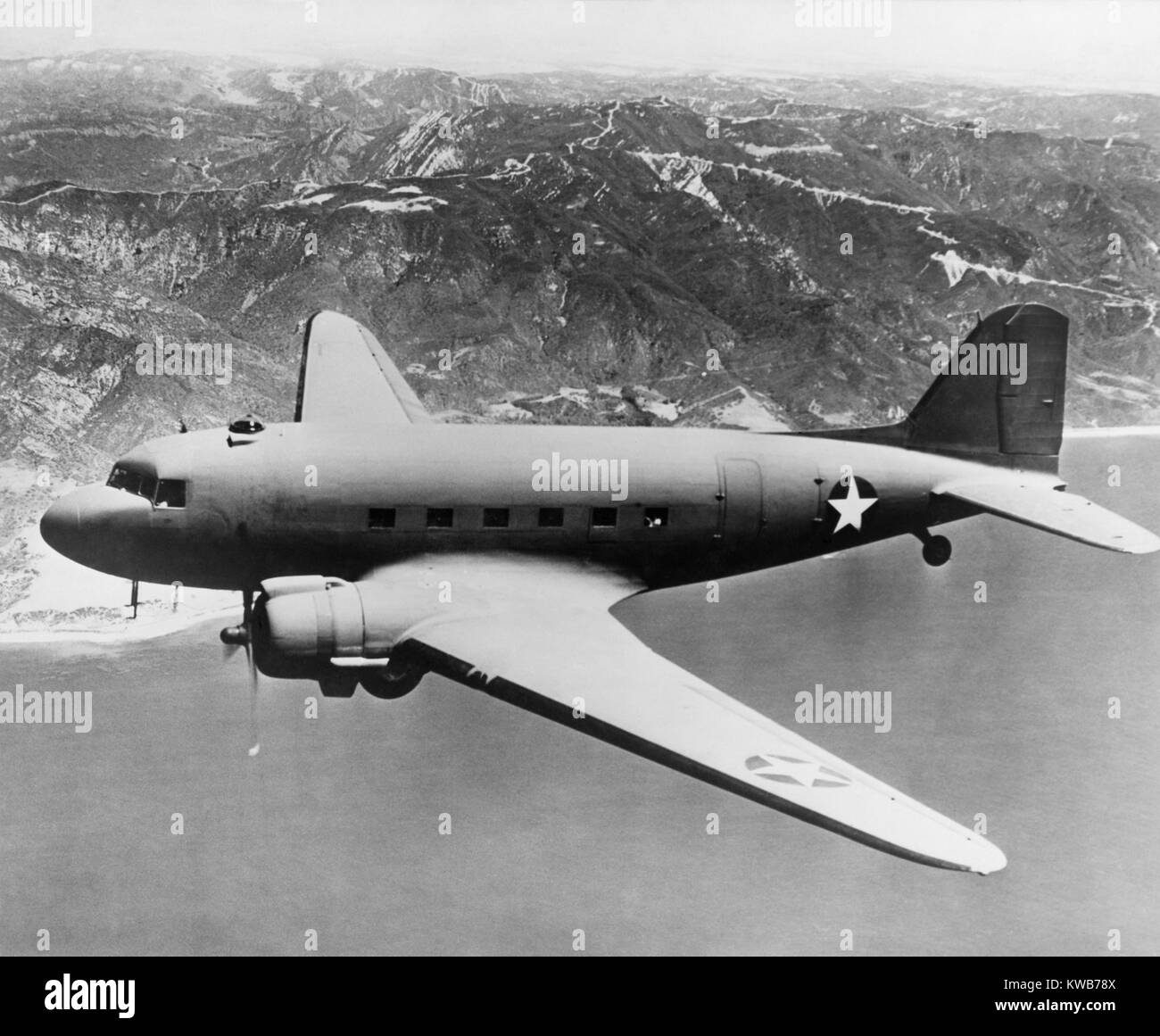 Douglas C-47 Skytrain in flight. The transport was used in in World War 2 and the Korean War. It was also developed as the civilian Douglas DC-3 airliner. Ca. 1942-45. (BSLOC 2014 10 164) Stock Photo