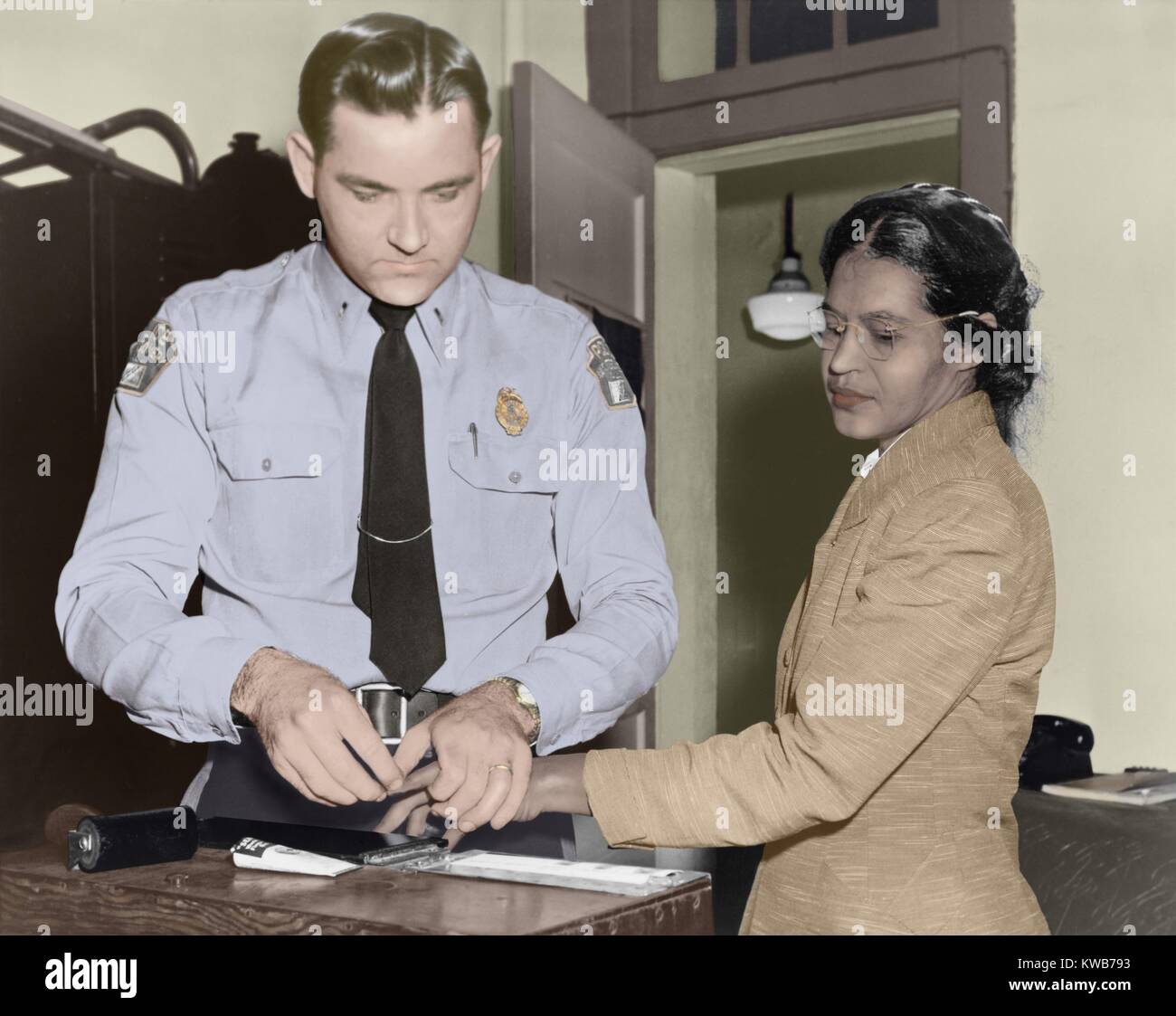 Rosa Parks is finger-printed by Deputy Sheriff D.H. Lackey in Montgomery, Alabama, Feb. 22, 1956. She had been arrested with other African Americans, as part of the city's harassment of the bus boycott protesters. This arrest was made over 2 months after (BSIC 2016 9 10) Stock Photo