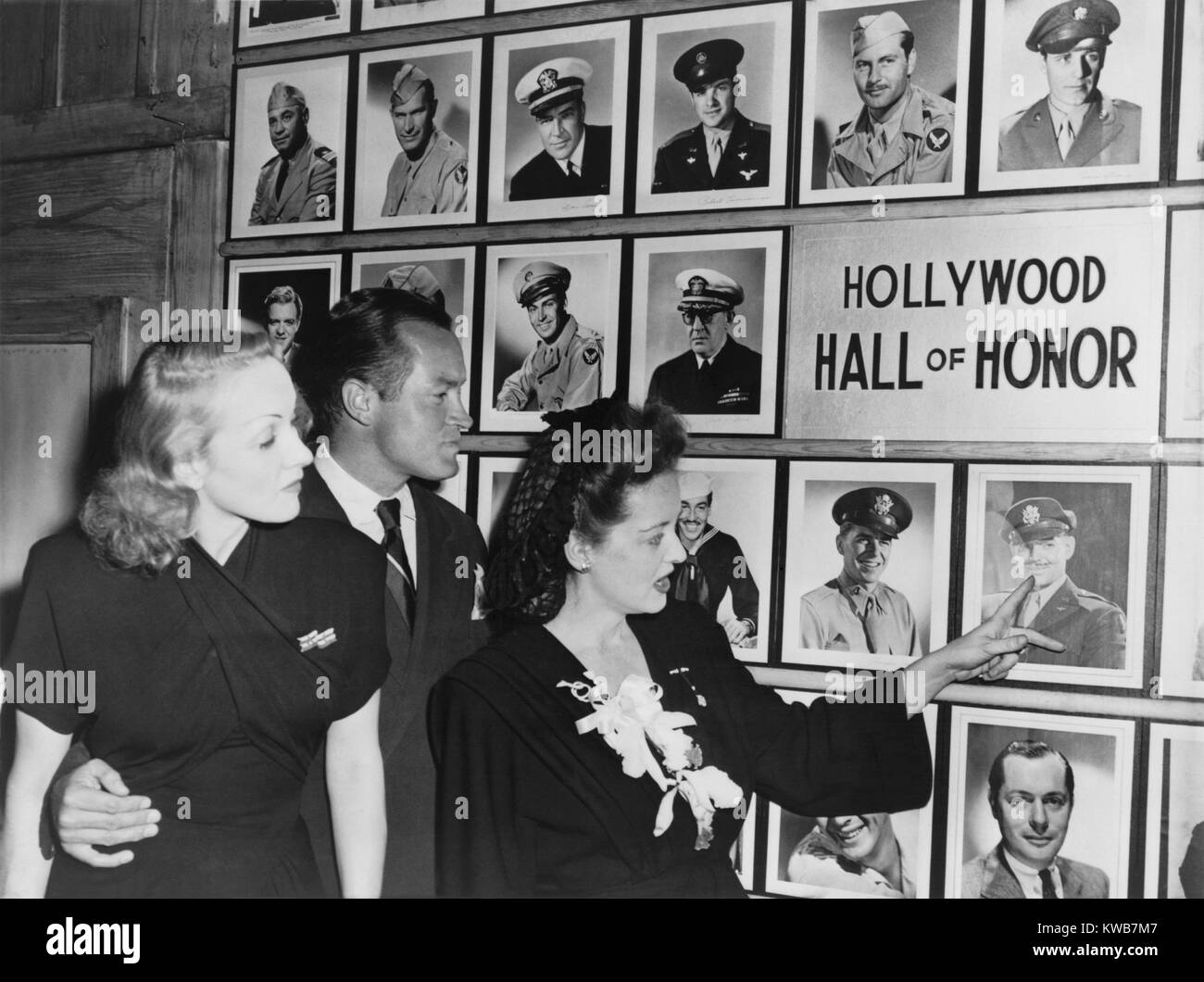 Wall of Honor in the Hollywood Canteen for servicemen during World War 2. Marlene Dietrich, Bob Hope, and  Bette Davis were very active 'war workers' entertaining troops at home and in battle zones. Actors represented on the Wall of Honer include: Clark Gable, Ronald Reagan, Robert Montgomery, Cesar Romero, John Ford, 1943.Van Heflin, Alan Ladd, Robert Cummings and George Montgomery. (BSLOC 2014 10 241) Stock Photo