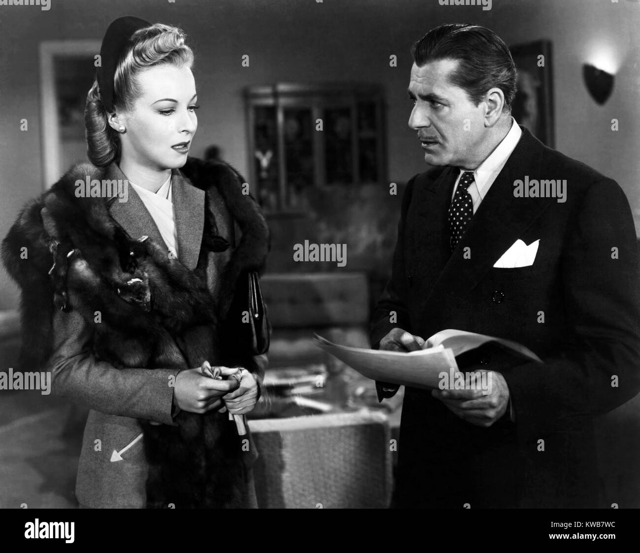 THE CRIME DOCTOR'S COURAGE, from left, Hillary Brooke, Warner Baxter ...