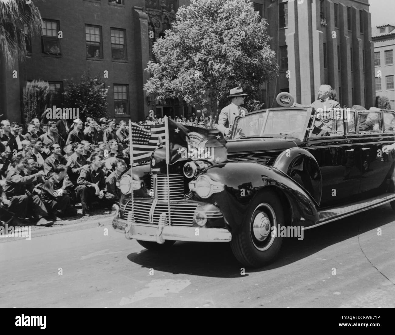 President Harry Truman waving to soldiers wounded in Pacific combat. His limousine passes the lawn at the Hamilton Field Hospital near San Rafael, California. Truman was in San Francisco attending the United Nations Charter signing ceremonies. April 26, 1945. World War 2. (BSLOC 2014 8 197) Stock Photo