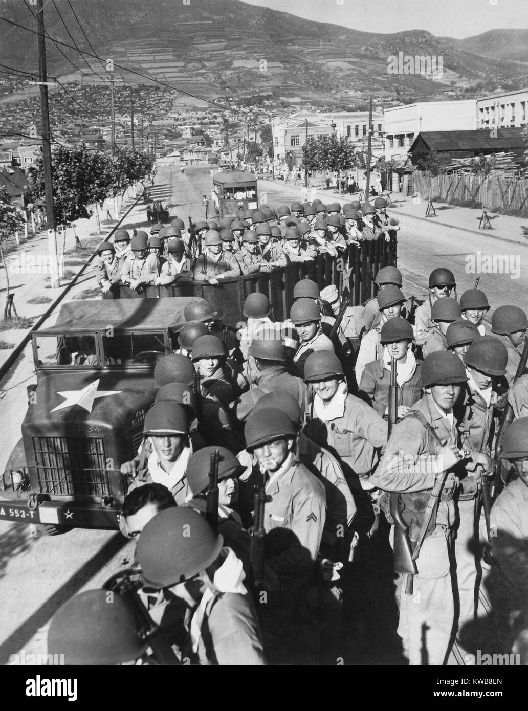 U.S. Marine troops arrived at the port of Pusan the day before, in trucks bound for the fighting on the Pusan Perimeter. Aug. 3, 1950. Korean War, 1950-53. (BSLOC 2014 11 12) Stock Photo