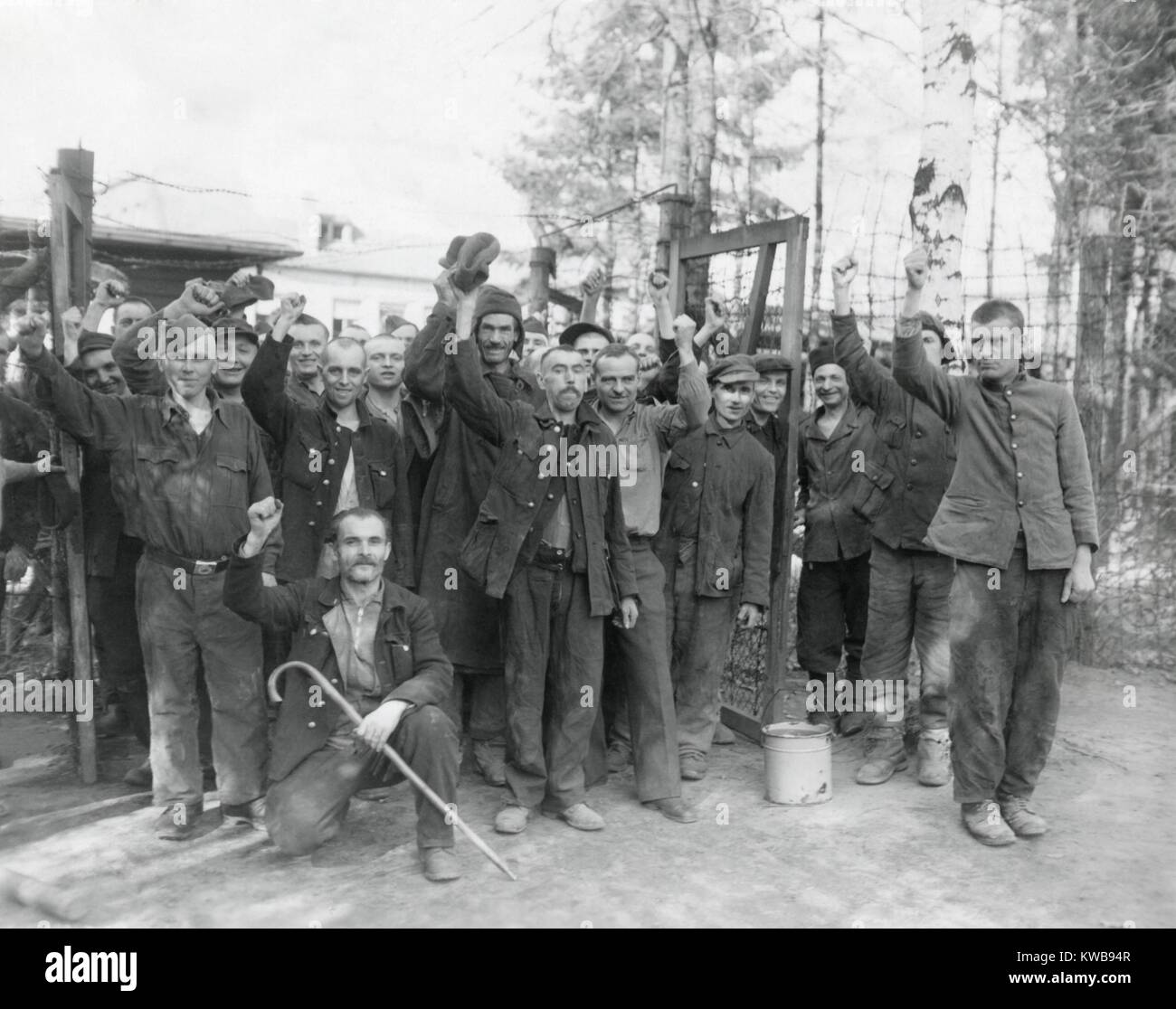 Allied POW cheer their liberty after being freed near Homburg, Germany, by 7th U.S. Army troops. Some of the Russians, Czechs, Poles, and French had been prisoners for three years. March 22, 1945. World War 2. (BSLOC 2014 10 184) Stock Photo