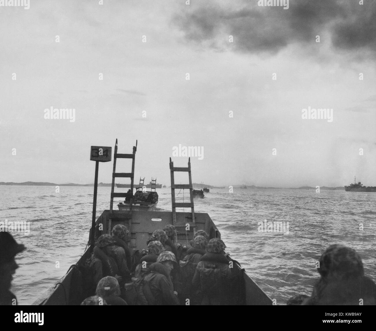 Landing craft loaded with U.S. Marines heads for the seawall at Inchon. They carry scaling ladders to climb over the 8 foot high seawall in their landing zone, Red Beach. Sept. 15, 1950. Korean War, 1950-53. (BSLOC 2014 11 37) Stock Photo