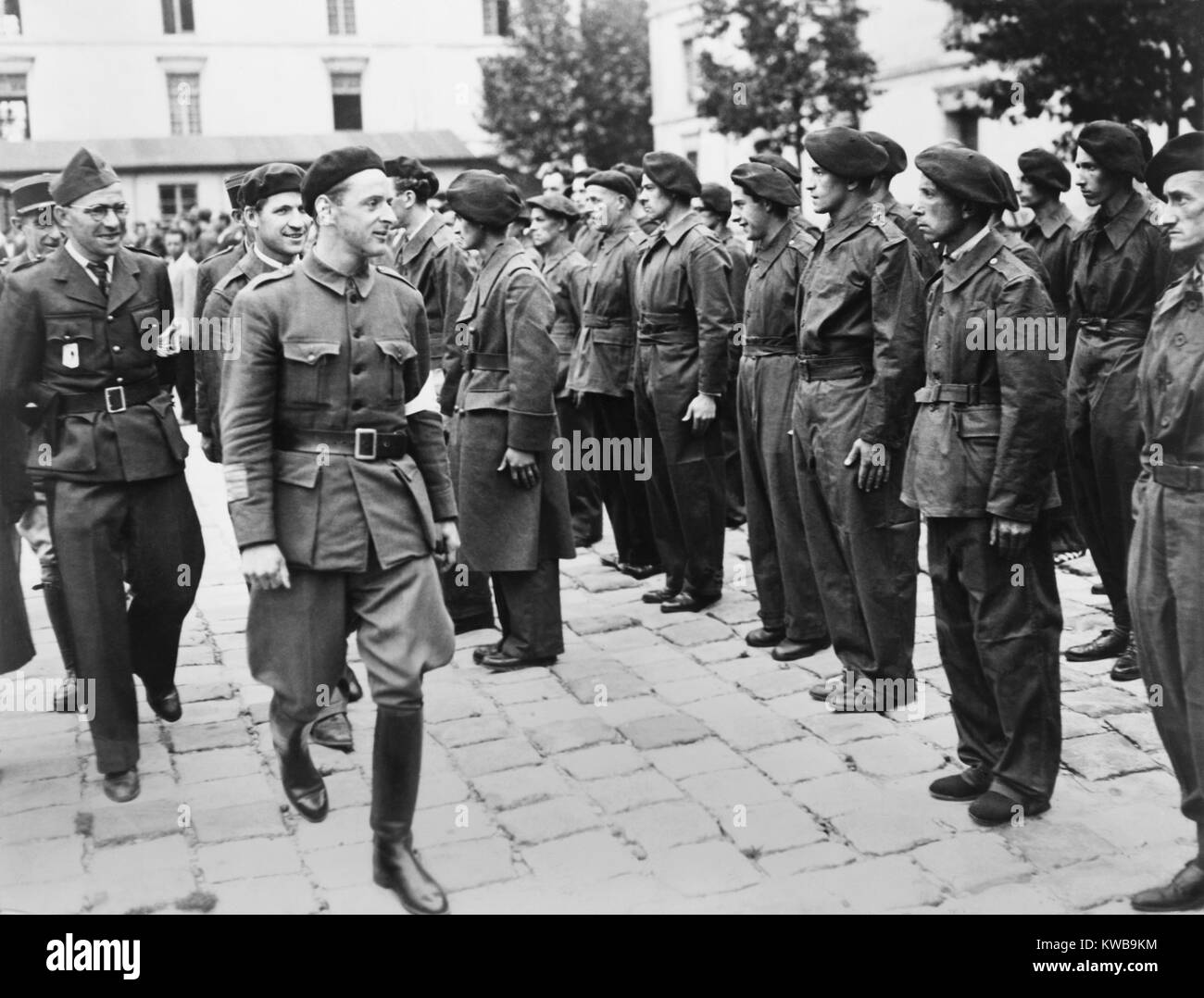 Henri Tanguy, 'Colonel Rol' inspecting French Forces of the Interior (FFI) in Paris. He had been one of the leaders of Communist resistance before liberation in Aug. 1944. World War 2. (BSLOC 2014 10 69) Stock Photo