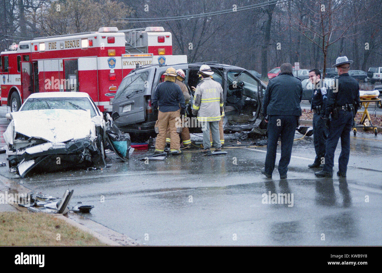 police and firefighters investigate an auto accident with injuries in Hyattsville, Maryland Stock Photo