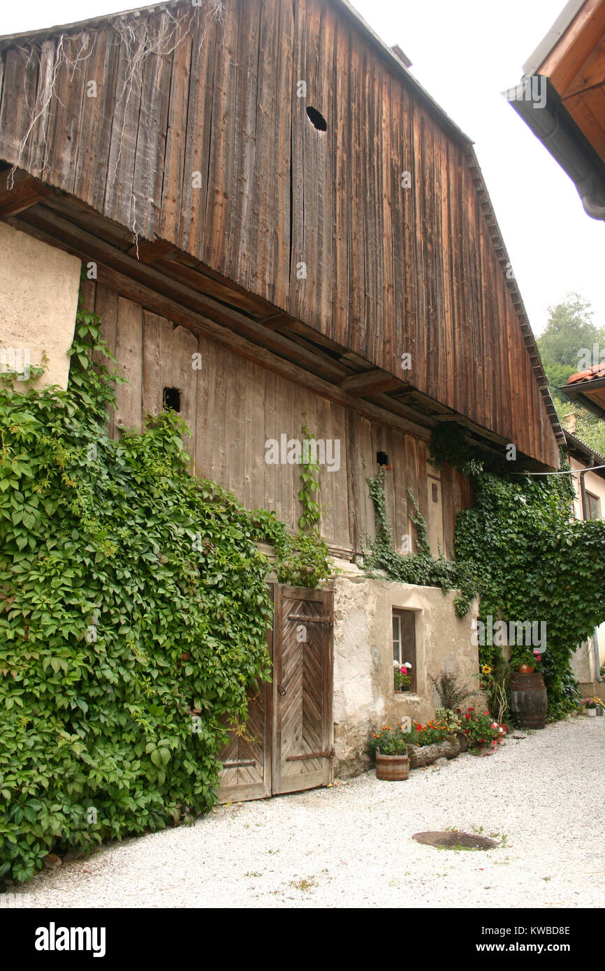 Traditional architecture in Austria's countryside. Exterior view of a large barn. Stock Photo