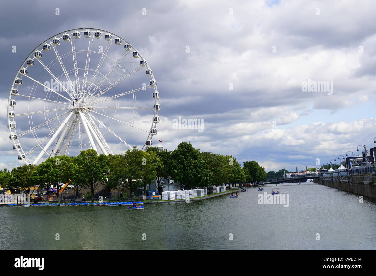 Ferris wheel at the Old Port of Montreal, a historic port in Old Montreal Quebec, Canada Stock Photo