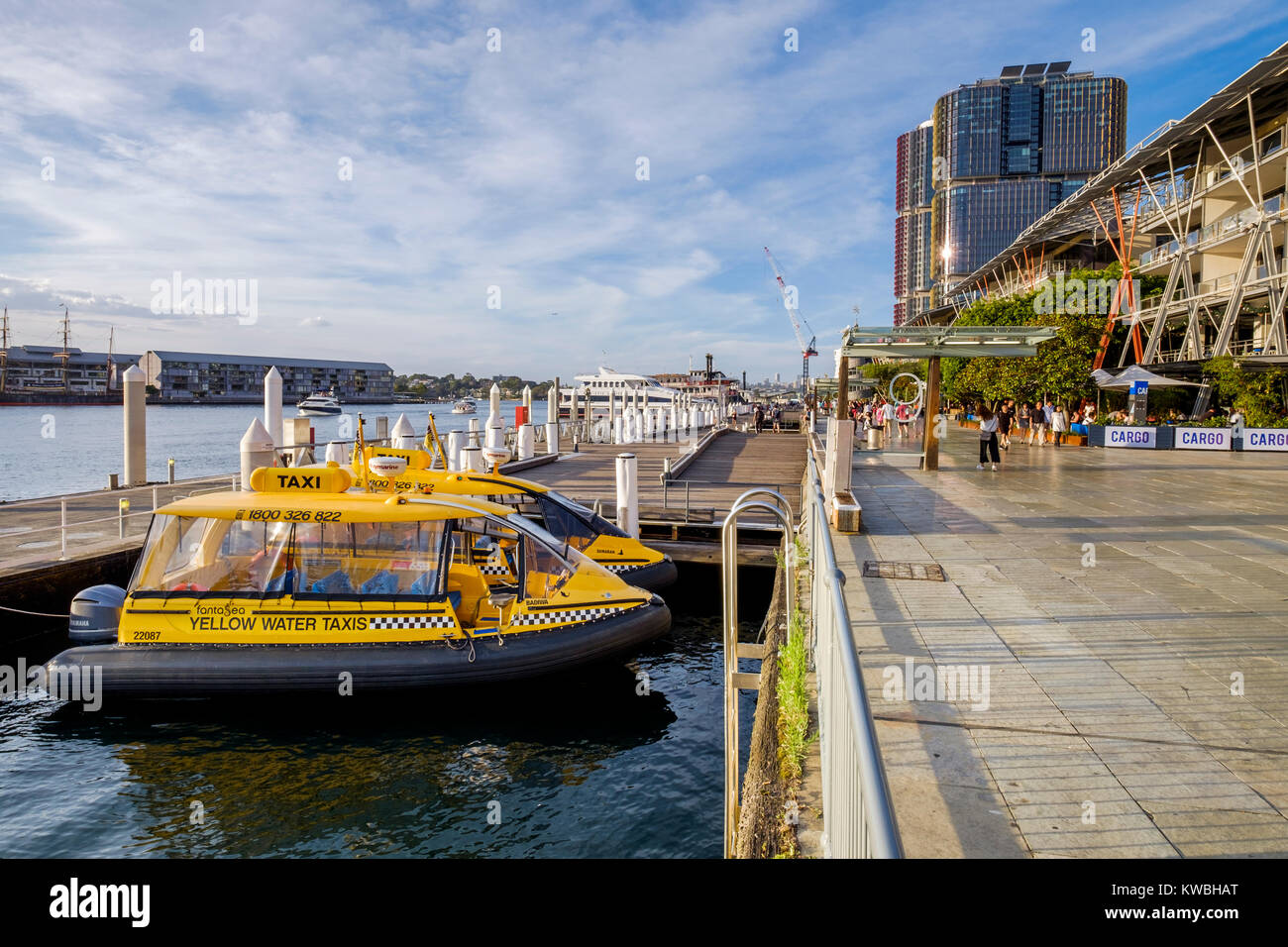 Yellow water taxi moored at Cockle Bay in Darling Harbour (Harbor), Sydney, Australia Stock Photo