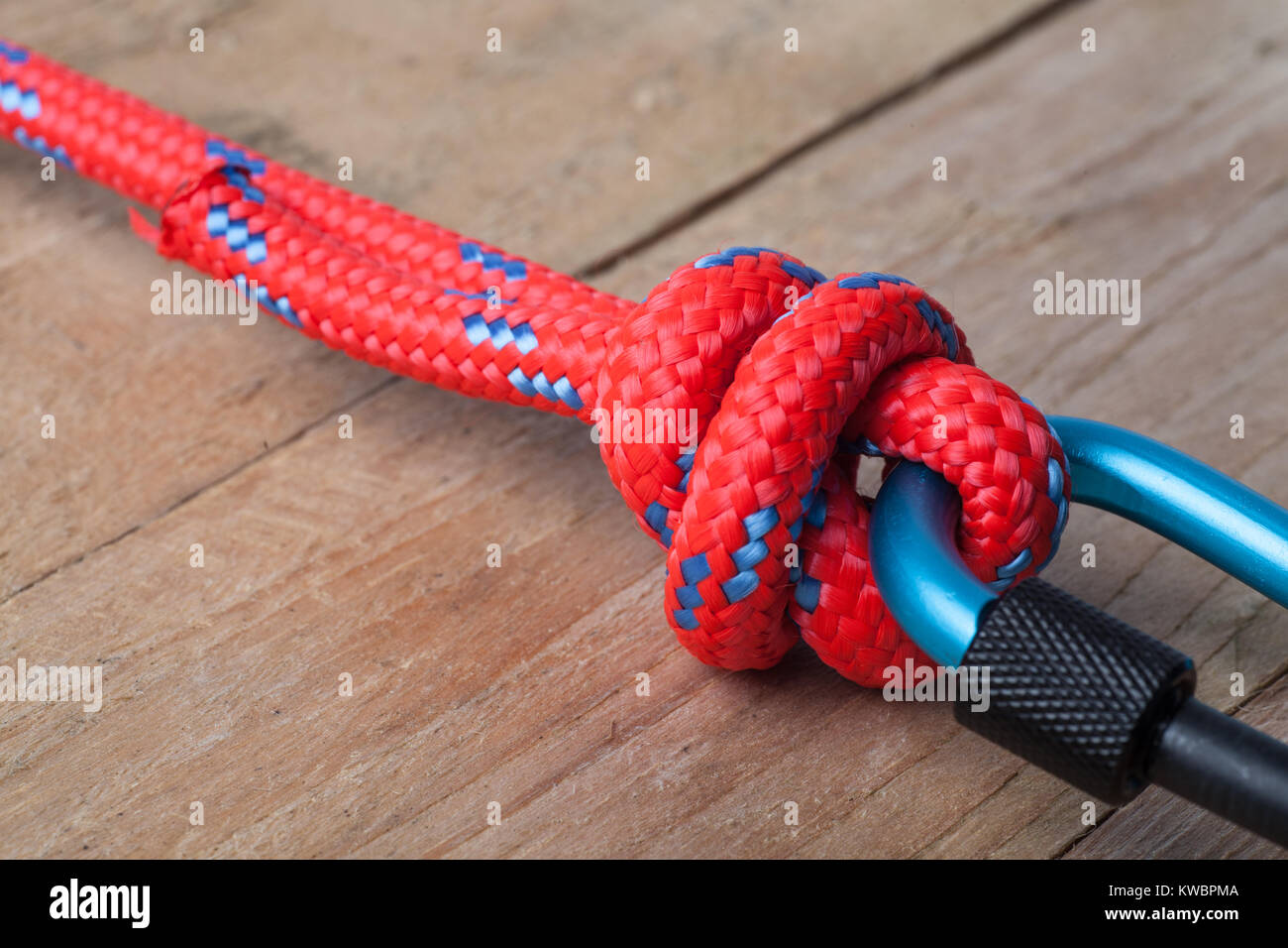 Fishermans Knot with Red Rope on Carabiner Stock Photo