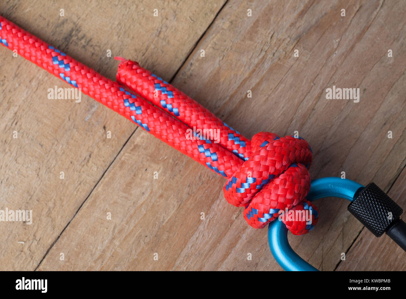 Fishermans Knot with Red Rope on Carabiner Stock Photo