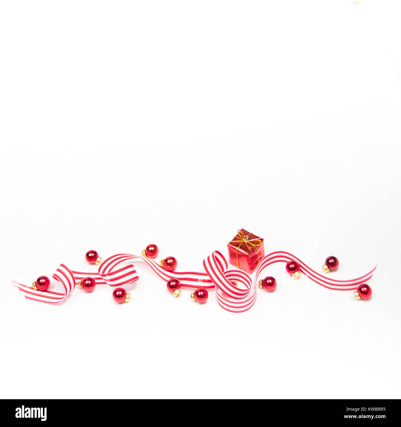 White and Red Striped Ribbon on White Background with Extra Space for