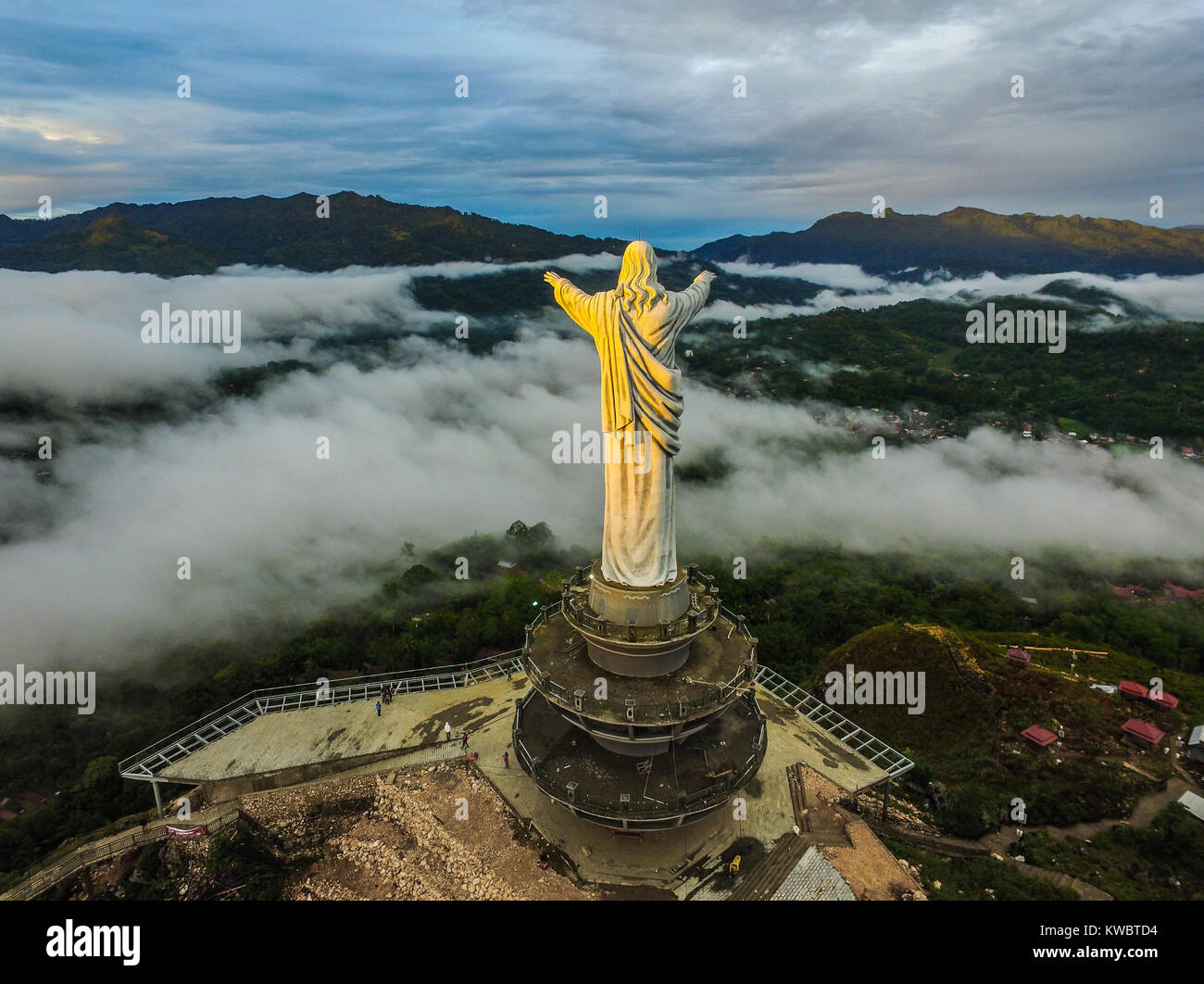 Statue of Jesus Christ at Buntu Burake Hill, Tana Toraja - South Sulawesi. The statue facing to the city of Makale, taken exactly during the sunrise. Stock Photo