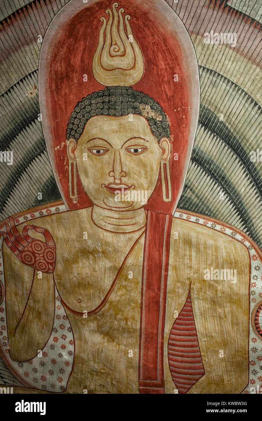 Valuable tempera paintings with Buddha image on the cave ceiling dating from the 18th century in Dambulla Cave Temple, Sri Lanka. This complex is a Wo Stock Photo