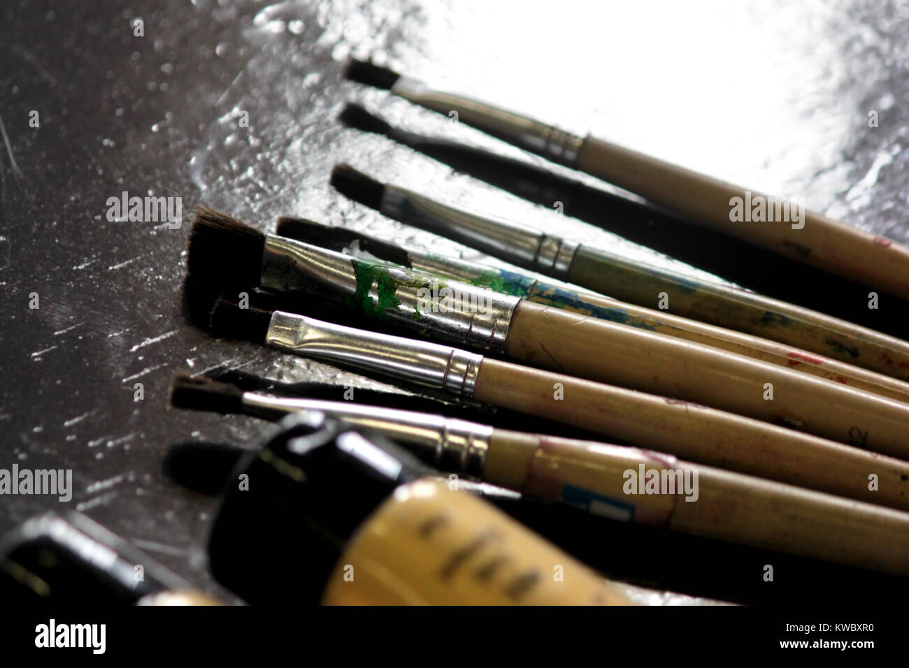 art materials, artists paint brushes on wooden table Stock Photo