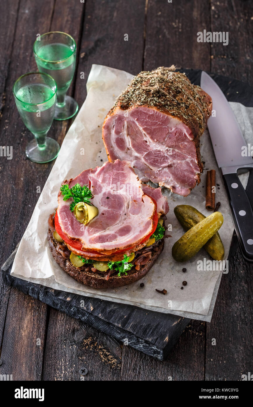 Opened homemade sandwich with smoked meat, tomato, onion jam and ico cold vodka Stock Photo Alamy