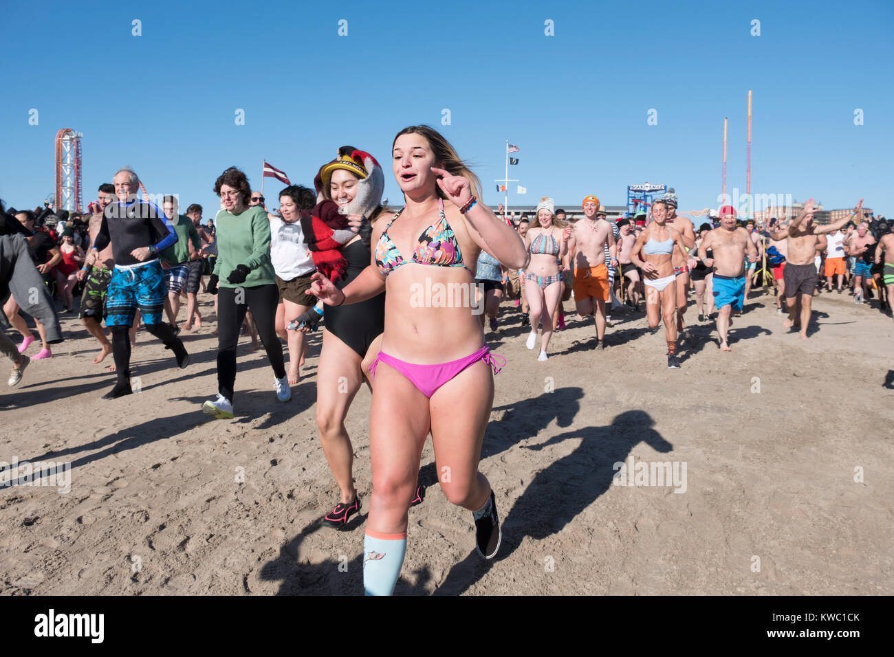 The first swimmers head for the Atlantic Ocean at the 114th Polar Bear Club New Year's Day swim. Stock Photo