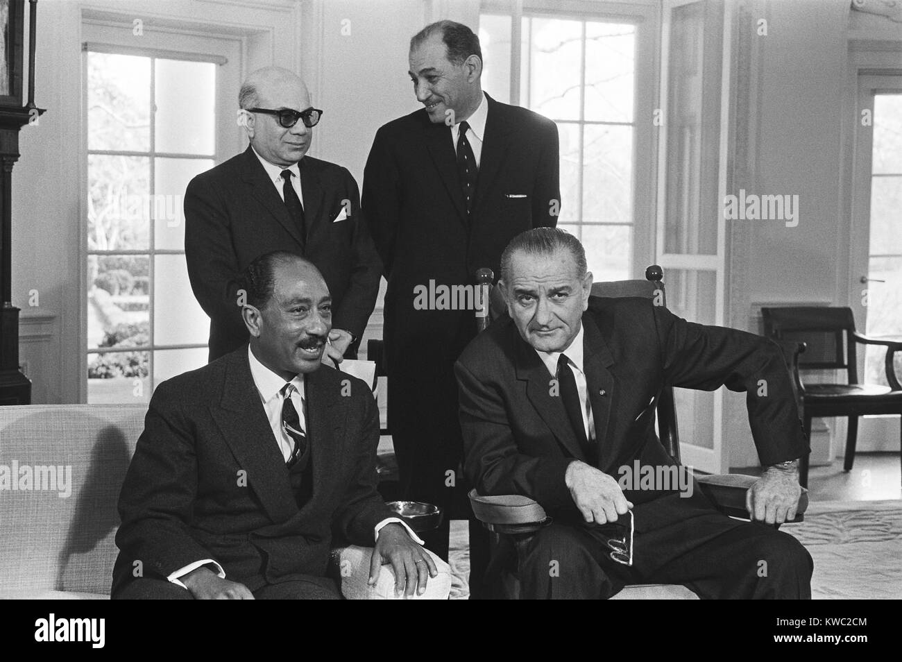 President Lyndon B. Johnson, seated with Anwar Sadat, in the Oval Office, Feb.2, 1966. Sadat was then President of the National Assembly of the United Arab Republic, and succeeded Nasser in 1970. (BSLOC 2015 2 217) Stock Photo