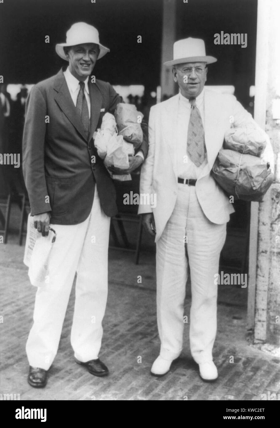 FDR's feuding but indispensable New Dealers, Harold L. Ickes and Harry Hopkins. Oct. 19, 1935 during a trip to Panama with FDR, when he tried unsuccessfully to reconcile their differences. Ickes managed the PWA, the large-scale Public Works Administration whose construction projects required long term oversight. Hopkins headed the Works Progress Administration (WPA), whose small work projects became the largest employer in the country during the Great Depression. (BSLOC 2015 2 245) Stock Photo