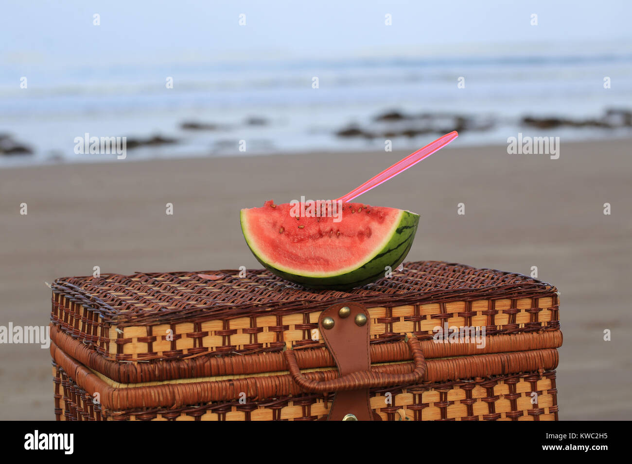 water melon sitting on  a picnic basket Stock Photo