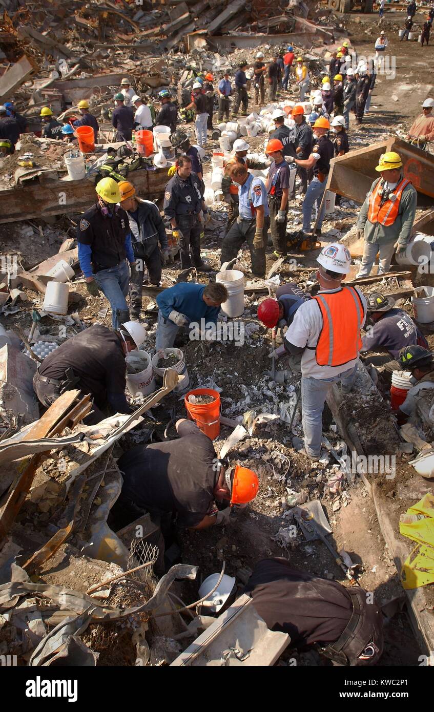 Rescue workers clear the rubble of the World Trade Center one bucket at a time. Sept. 15, 2001. New York City, after September 11, 2001 terrorist attacks. U.S. Navy Photo by Journalist 1st Class Preston Keres (BSLOC 2015 2 80) Stock Photo