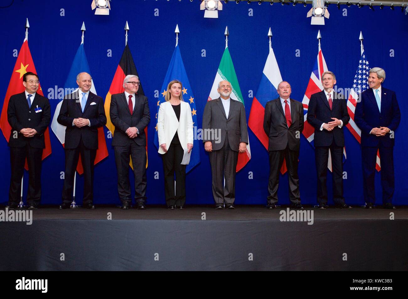 Photo of the P5+1 member nations and Iranian officials at the end of negotiations, April 2, 2015. L-R: Hailong Wu, China; Laurent Fabius, France; Frank-Walter Steinmeier, Germany; Federica Mogherini, European Union High Representative; Iranian Foreign Minister Javad Zarifat; unidentified Russian official; Philip Hammond, Britain; and John Kerry, USA. (BSLOC 2015 13 287) Stock Photo