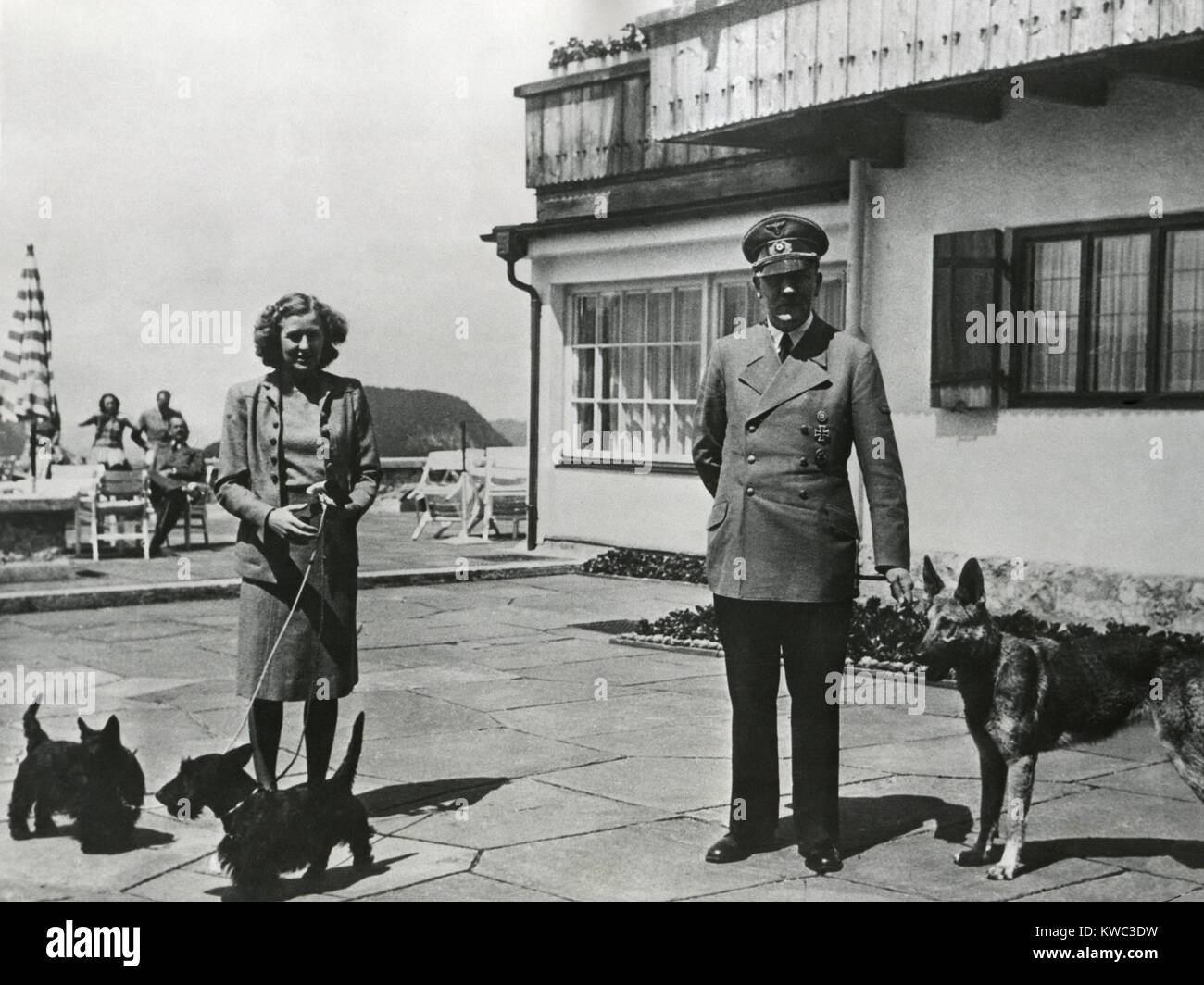Hitler and Ava Braun with their dogs at Berchtesgaden, ca. 1937-1943. Braun and Hitler remained a couple for 13 years, from 1932-1945. (BSLOC 2015 13 61) Stock Photo