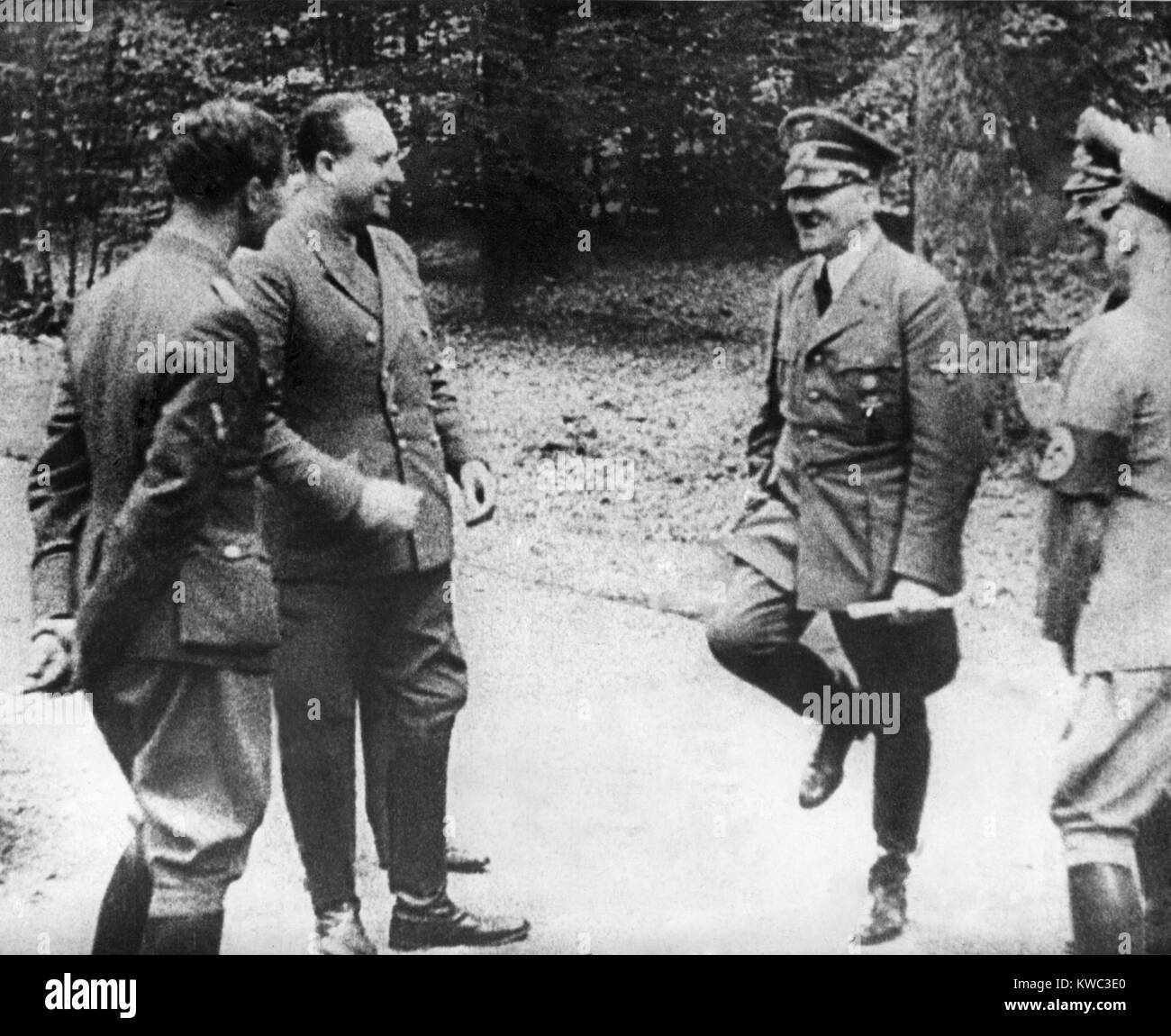 Adolf Hitler happily dances a jig before signing of the World War 2 French Armistice, June 22, 1940.With his staff, Hitler was in Le Francport, Compiegne, where defeated Germany signed the armistice marking their World War 1 defeat on Nov. 11, 1918 (BSLOC 2015 13 63) Stock Photo