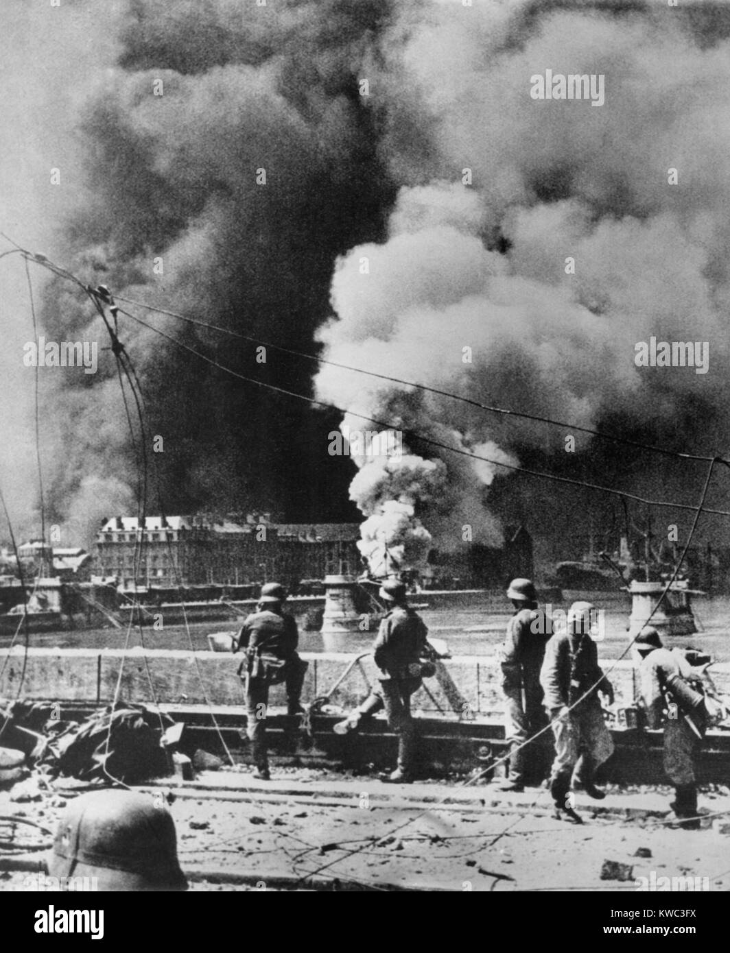 Rotterdam's city center burning after aerial bombardment by the Luftwaffe, May 14, 1940. Soon afterward the German air force threatened to destroy the city of Utrecht if the Dutch Government did not surrender, which they did. World War 2 (BSLOC 2015 13 89) Stock Photo