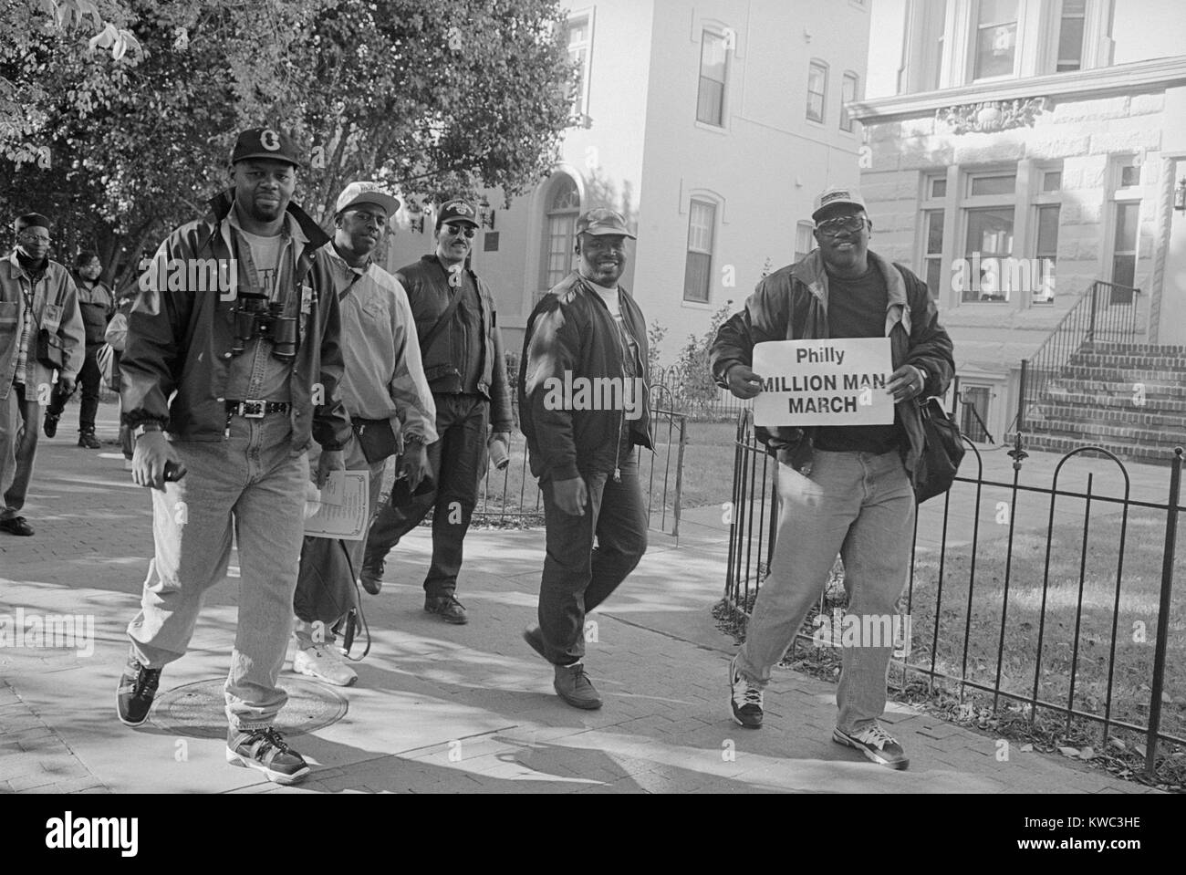 African American men walking on Capitol Hill, during the Million Man March in Washington, D.C. Oct. 16, 1995. The March's purpose was to 'convey to the world a vastly different picture of the Black male' and 'To unite in self-help and self-defense against economic and social ills.' (BSLOC 2015 14 108) Stock Photo