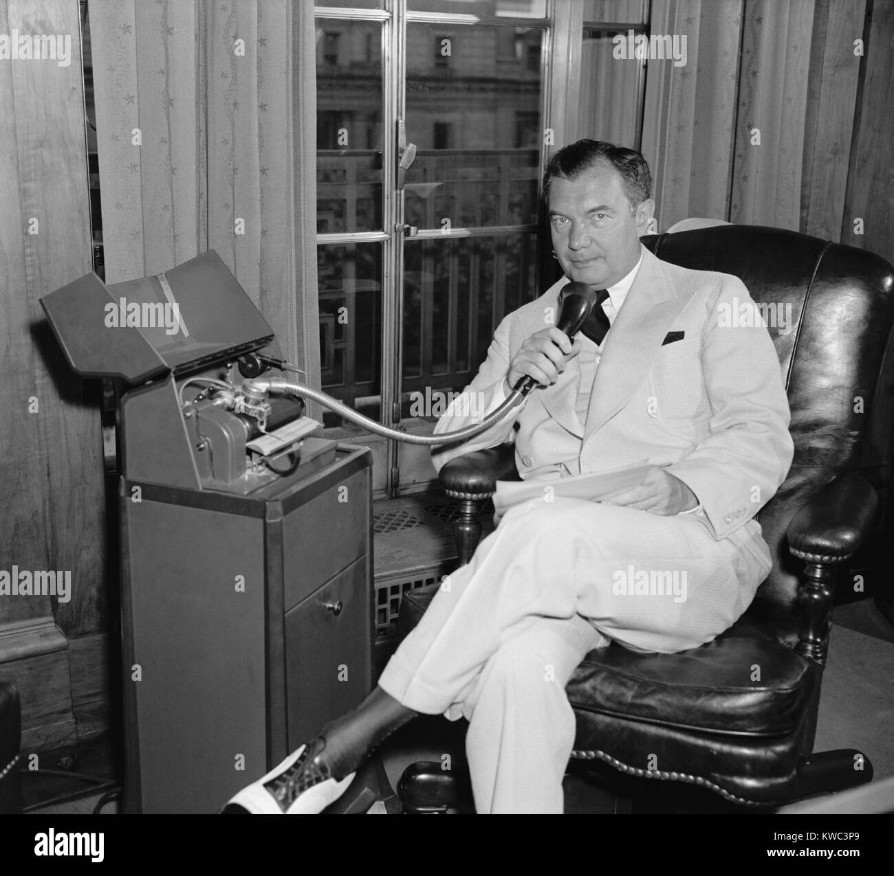 Attorney Gen. Robert H. Jackson, speaking into a Dictaphone on July 12, 1940. Dictaphones were voice recording devices invented in the 1880. Until the late 1940s, they used wax cylinders for voice recording. Robert H. Jackson, was appointed to the Supreme Court in 1941. (BSLOC 2015 14 16) Stock Photo