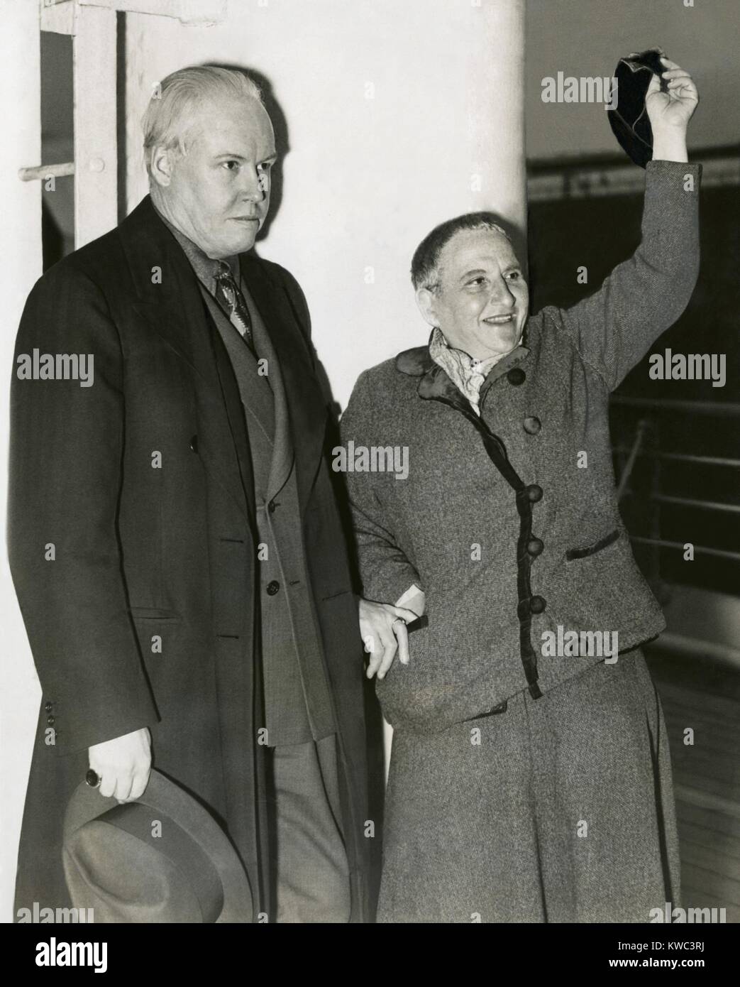 Photographer Carl Van Vechten with Gertrude Stein as she waves her hat from S.S. Champlain. May 4, 1935. Stein had been part of the expatriate art community is Paris for decades. In 1933 she published a best selling memoir, 'The Autobiography of Alice B. Toklas,' written in the voice of Toklas, her life partner. (BSLOC 2015 14 179) Stock Photo