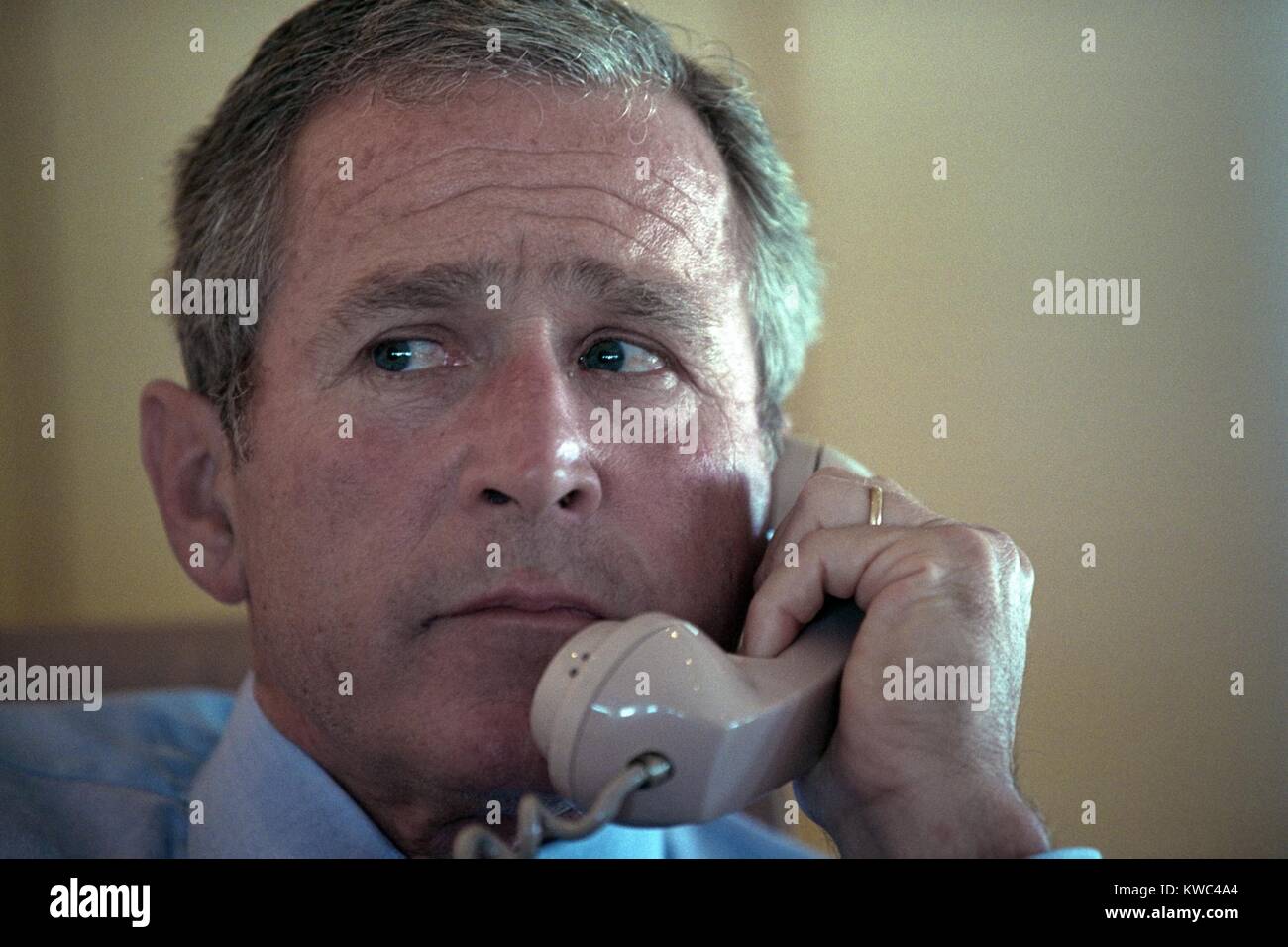 President George W. Bush on the phone aboard Air Force One on Sept. 11, 2001. After learning of the 9-11 Terrorist attacks, AF1 flew from Sarasota, to Barksdale Air Force Base, in Nebraska. (BSLOC 2015 2 133) Stock Photo