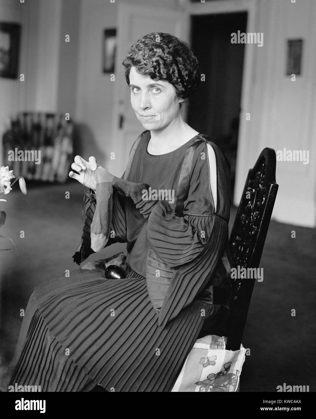 First Lady Grace Coolidge darning socks on August 6, 1923. It was four days after the death of President Warren Harding. Photo was probably taken in the Coolidge's suite at the Willard Hotel. (BSLOC 2015 15 156) Stock Photo