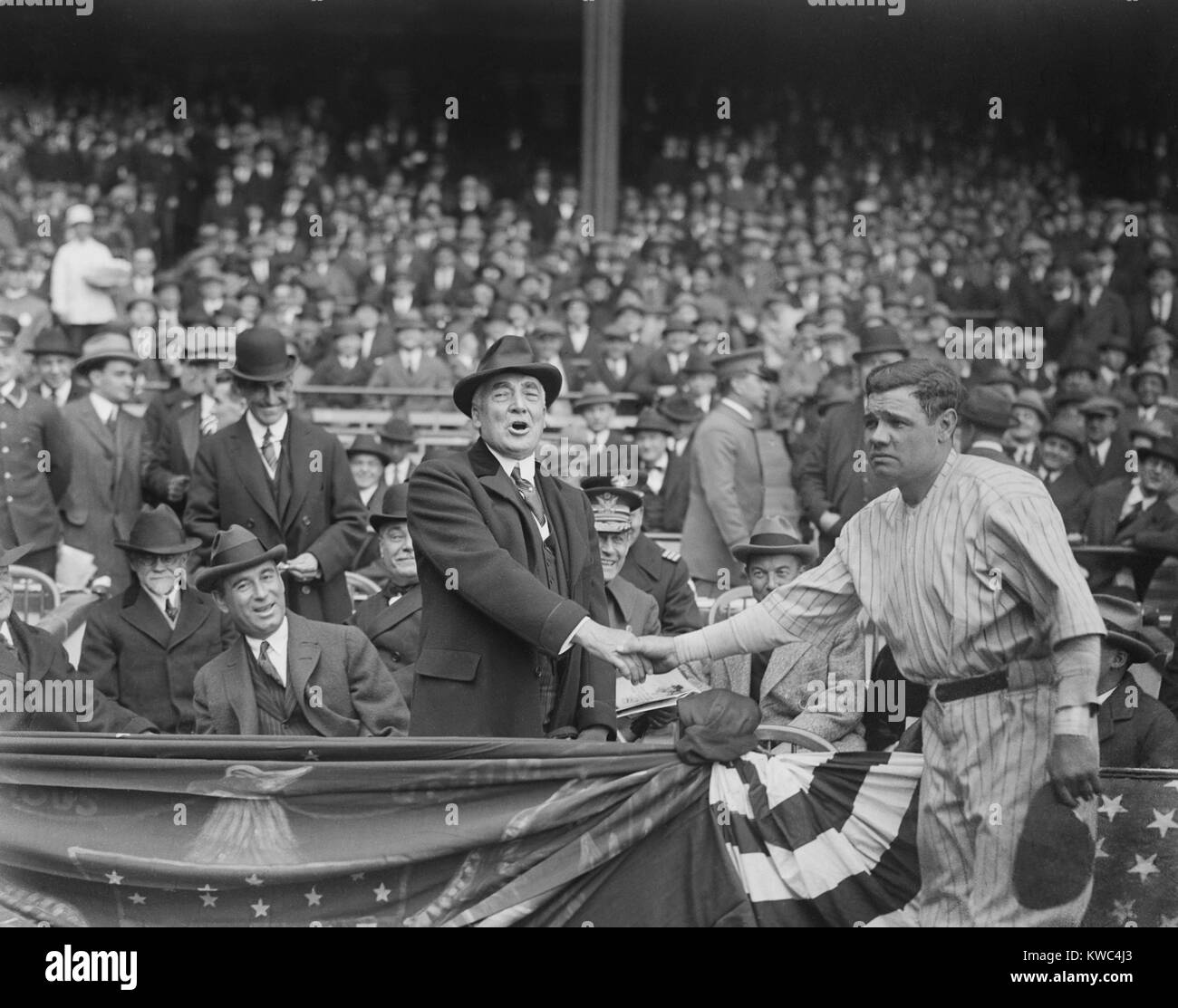 President Warren Harding shakes hands with Babe Ruth at Yankee Stadium, April 24, 1923. (BSLOC 2015 15 50) Stock Photo