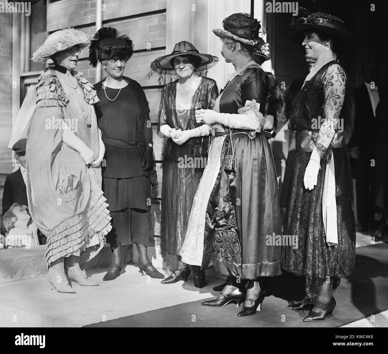 First Lady Florence Harding (left) with a group including Grace Coolidge (right). Ca. 1921-23. The women wear elaborate early 1920s loose fitting dresses and large hats. (BSLOC 2015 15 69) Stock Photo