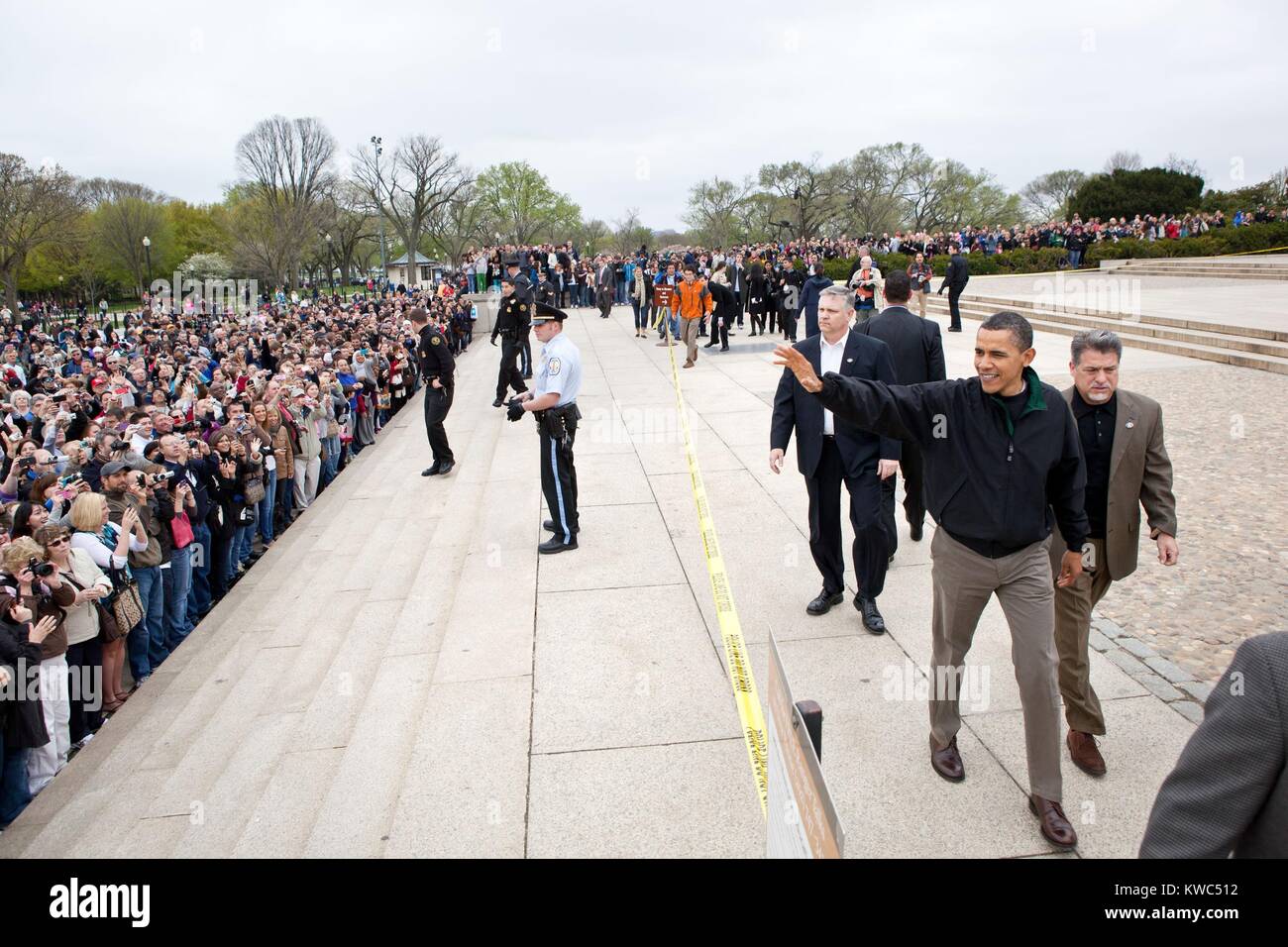 President Barack Obama waves to tourists at the Lincoln Memorial in Washington, D.C., April 9, 2011. On the previous day, Obama and Congressional leaders agreed on a bill to prevent a threatened government shutdown. (BSLOC 2015 13 216) Stock Photo