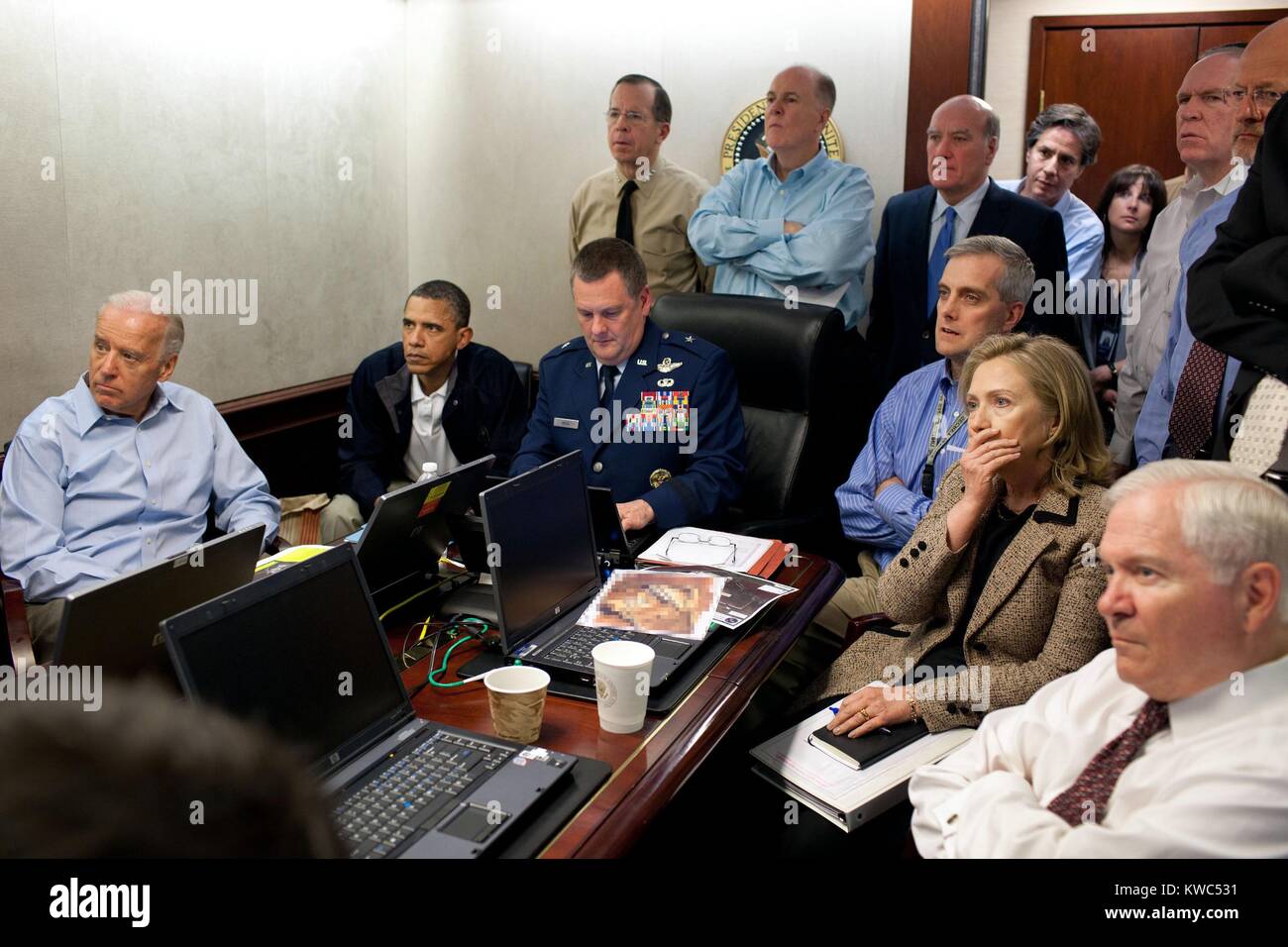 'Operation Neptune's Spear,' the mission against Osama bin Laden, May 1, 2011. President Obama, VP Biden and the national security team receive an update in the Situation Room. Seated, L-R: VP Joe Biden; The President; Brig. Gen. Marshall Webb, USAF, Joint Special Operations Command; Denis McDonough, Deputy National Security Advisor; Hillary Clinton, Sec. of State; and Robert Gates, Sec. of Defense. Standing, L-R: Admiral Mike Mullen, USN, Chmn. Joint Chiefs; Tom Donilon, National Security Advisor; Bill Daley, Chief of Staff; Tony Blinken, Nat. Security Advisor to VP; Audrey Tomason, Dir. For  Stock Photo