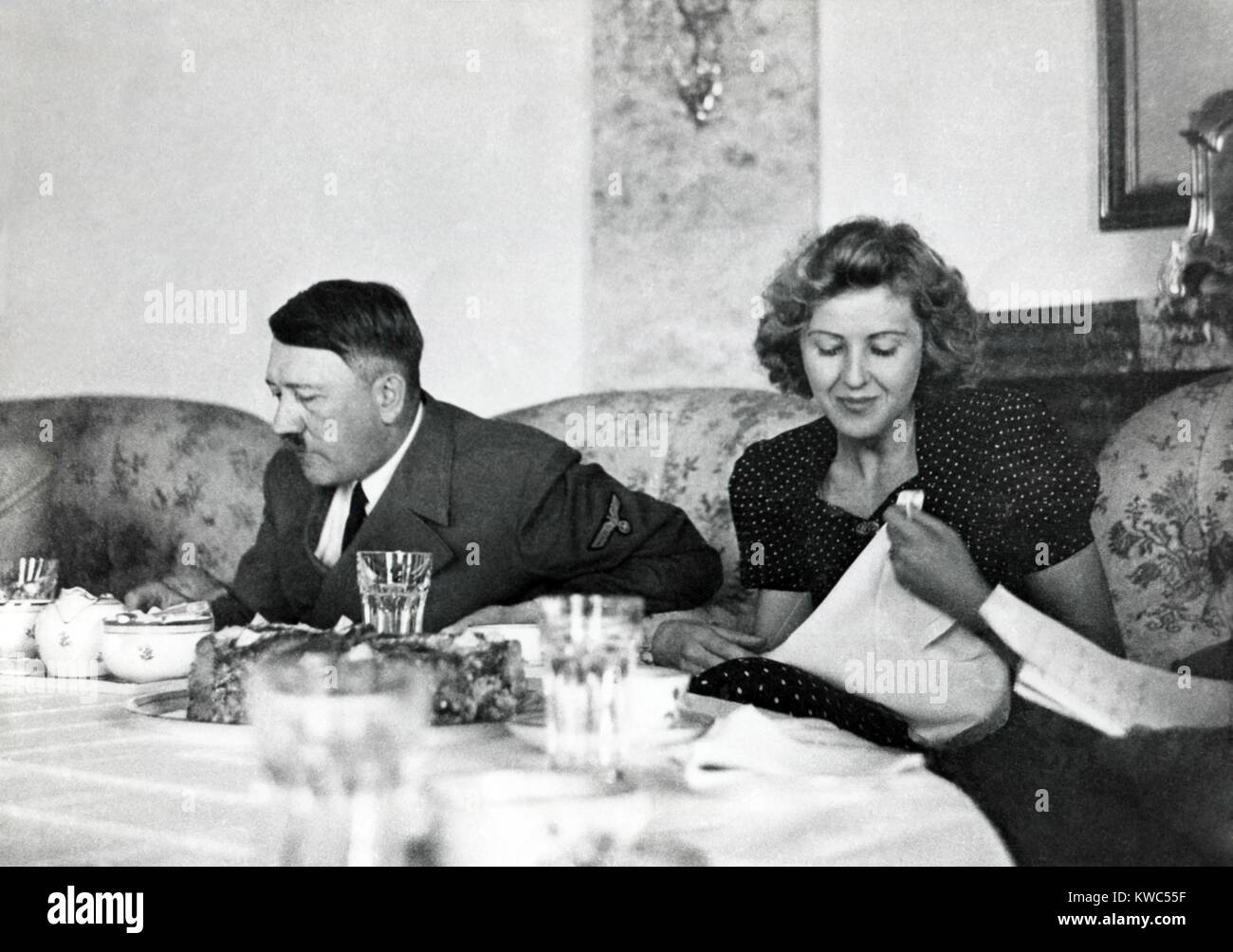 Hitler and Ava Braun at dining table at Berchtesgaden, ca. 1937-1943. Braun was the hostess at informal gatherings, but hidden away when high officials visited the Bavarian retreat. (BSLOC 2015 13 60) Stock Photo