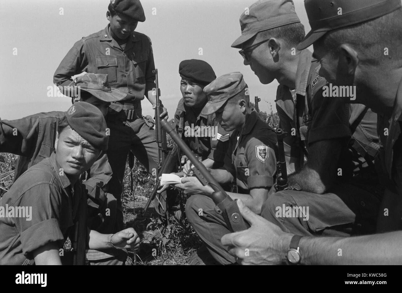 South Vietnamese soldiers with American soldiers during a military operation in South Vietnam. Feb. 12, 1962. Photo by Robert Pepper Martin. (BSLOC 2015 14 133) Stock Photo