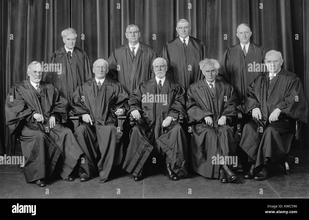 The Justices of the Supreme Court, 1937-38. Sitting, from left to right, Justices George Sutherland, James McReynolds, Chief Justice Charles Evans Hughes, Justices Louis Brandeis and Pierce Butler. Standing, left to right, Justices Benjamin Cardozo, Harlan Stone, Owen Roberts, and Hugo Black. (BSLOC 2015 14 15) Stock Photo